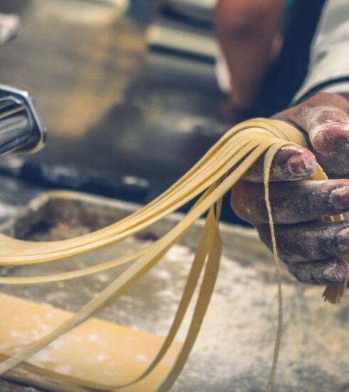 Pasta - person sheeting dough