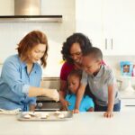 Snacks For Kids - man in blue dress shirt sitting beside woman in gray shirt