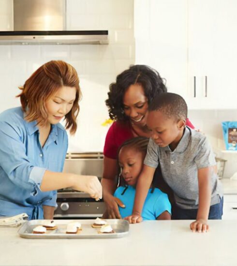 Snacks For Kids - man in blue dress shirt sitting beside woman in gray shirt