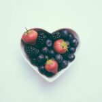 Nutrition - heart-shaped bowl with strawberries