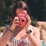 Swimwear - Woman Holding Pink Instant Camera