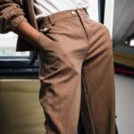 Pants - Woman Standing in Front of Mirror With Hands in Pockets