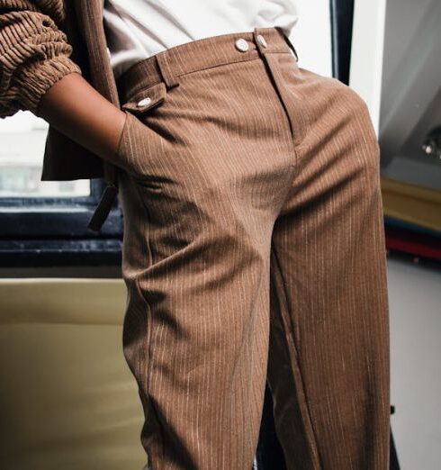 Pants - Woman Standing in Front of Mirror With Hands in Pockets