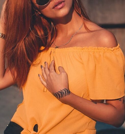 Shorts - Woman Wearing Yellow Off-shoulder Blouse and Black Shorts