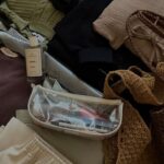 Tops - A suitcase filled with various items and clothes