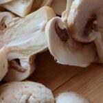 Healthy Eating - Mushrooms are cut into pieces on a cutting board