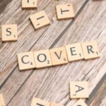 Cover-Up - The word cover spelled out with scrabble letters