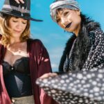 Scarves - 2 Women in Black and White Coat and Red Coat Standing on Beach