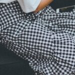 Skirt - Closeup Photo of Girl Playing Portable Console While Sitting in the Sofa