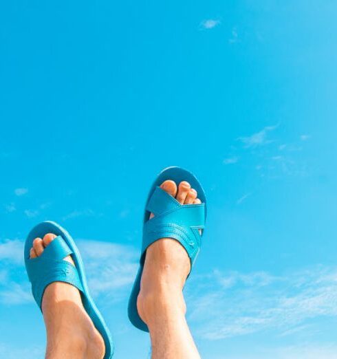 Sandals - Person Wearing Blue Slide Sandals Under Blue