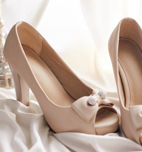 Footwear - Pair of Beige Leather Open-toe Heeled Platform Shoes on White Textile