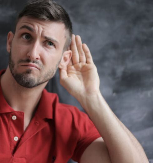 Listening - Man in Red Polo Shirt Sitting Near Chalkboard