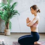 Mindfulness - Woman Meditating With Candles and Incense