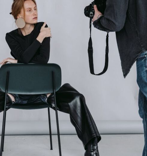 Techniques - Man in Black Long Sleeve Shirt and Blue Denim Jeans Sitting on Black Chair