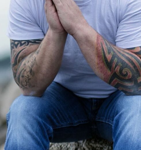 Mindfulness - Man Sitting on Gray Rock on Selective Focus Photo