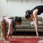 Mindfulness - Photo of Woman and Girl Stretching Their Body