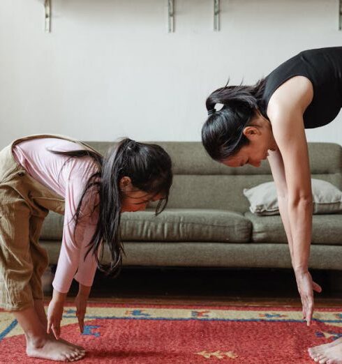 Mindfulness - Photo of Woman and Girl Stretching Their Body