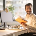 Work - Photo of Man Holding a Book