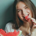 Eating - Woman Wearing White Shirt Eating Watermelon