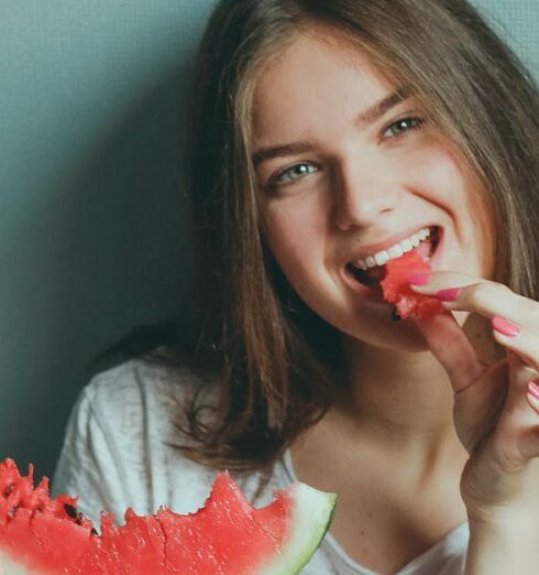 Eating - Woman Wearing White Shirt Eating Watermelon