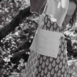 Tasks - Grayscale Photo of a Woman Hanging Clothes