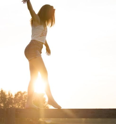 Balance - Woman Walking On Fence