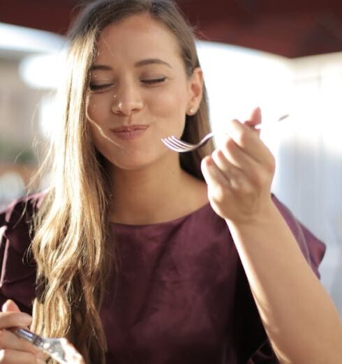 Eating - Woman in Purple Eating