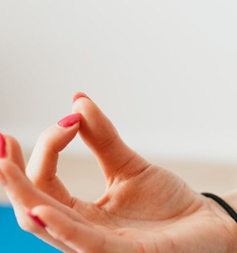 Mindfulness - Crop unrecognizable woman meditating in Lotus pose at home