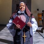 Habits - Nun Standing with Bible