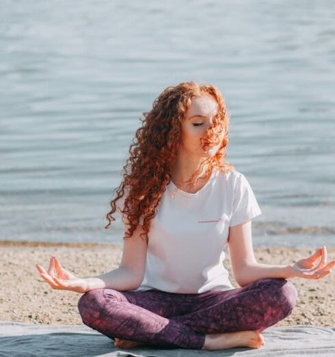 Discipline - Woman Doing Yoga Exercise At The Sea Shore