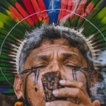 Practices - Man in Traditional Plume Smoking Pipe