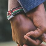 Relationships - close-Up Photo of Two Person's Holding Hands