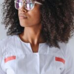 Traits - Woman in White Button Up Dress Wearing Sunglasses