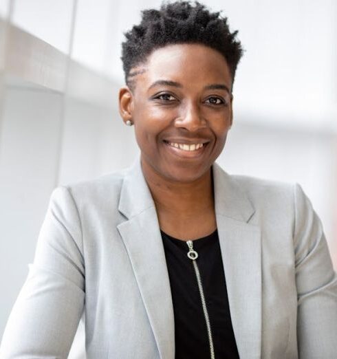 Confidence - Woman Wearing Gray Notch Lapel Suit Jacket