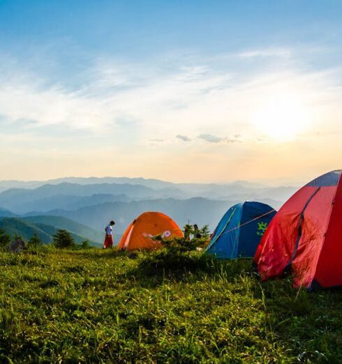 Camping - Photo of Pitched Dome Tents Overlooking Mountain Ranges