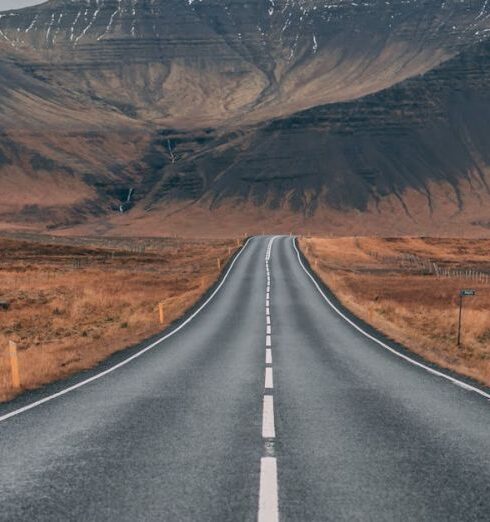 Adventure - Empty Highway Overlooking Mountain Under Dark Skies