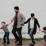 Family - Family Of Four Walking At The Street