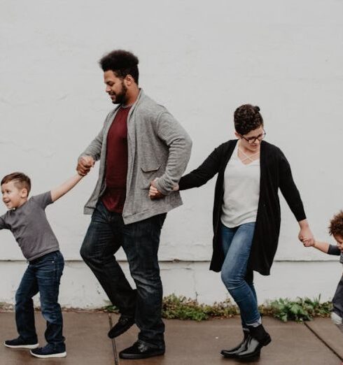 Family - Family Of Four Walking At The Street