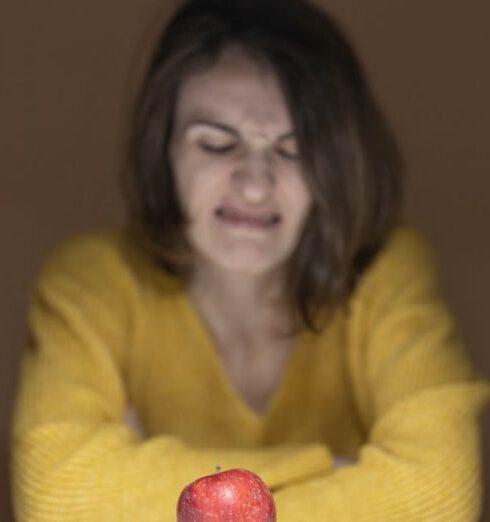 Diet - Woman Disgusted Looking at the Apple