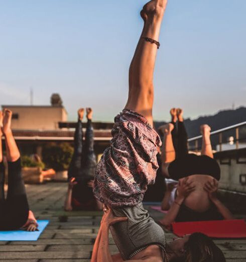 Yoga - Group of Women Lying on Yoga Mat Under Blue Sky