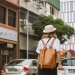 Traveling - View of a Woan on City Street