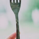 Eating - Person Holding Gray Steel Fork With Strawberry