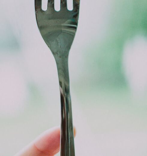 Eating - Person Holding Gray Steel Fork With Strawberry