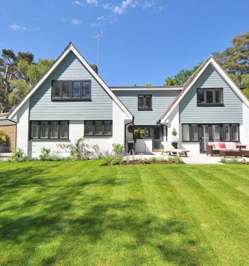 Landscaping - White and Gray Wooden House Near Grass Field and Trees