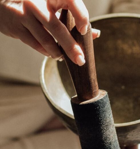 Practices - A Person Holding a Mallet and a Singing Bowl