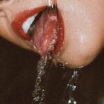 Self-Care - Woman Drinking Water from a Tap