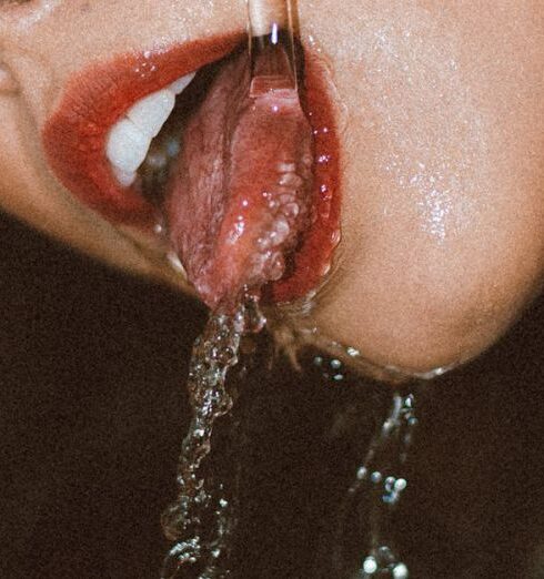 Self-Care - Woman Drinking Water from a Tap