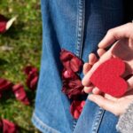 Compassion - Person Holding Heart Shaped Cut Out