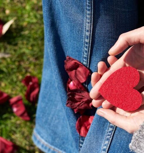 Compassion - Person Holding Heart Shaped Cut Out