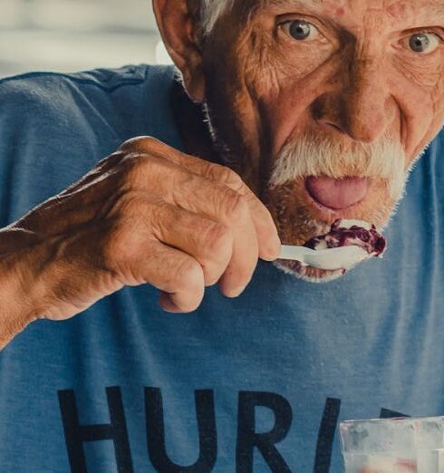 Eating - Man Wearing Blue Hurley Shirt